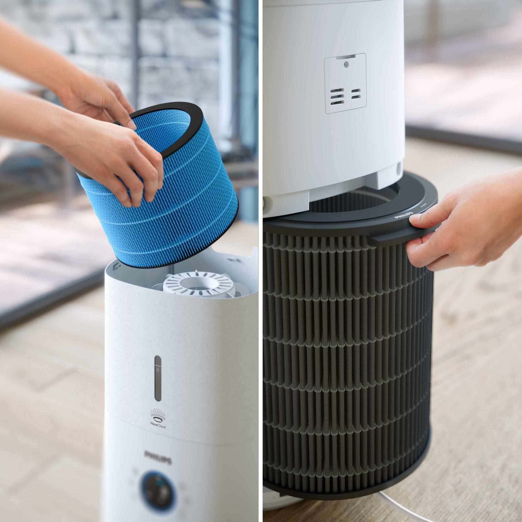 Attēlā redzama filtra nomaiņa Philips Climate Care 2in1 gaisa mitrinātājā, izceļot zilo un tumši pelēko filtru, kas nodrošina izcilu gaisa attīrīšanu.