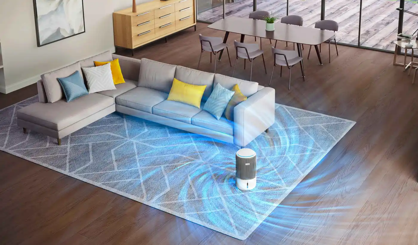 Attēlā redzams Philips Climate Care 2in1 gaisa attīrītājs un mitrinātājs ar izgaismotu gaisa plūsmu stilīgā dzīvojamā telpā. Tas izceļ izcilu gaisa kvalitāti un mitruma līdzsvaru.