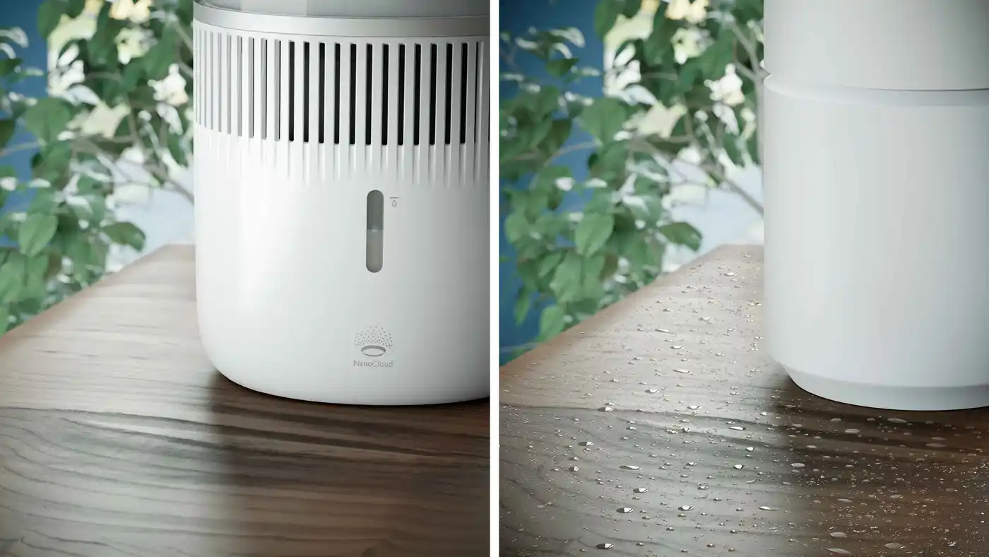 Air-Humidifier-2-fi Eleganta, balta Philips gaisa mitrinātāja tuvplāns ar ūdens līmeņa indikatoru un NanoCloud tehnoloģiju uz koka pamatnes, kurā redzama migla optimālam mitrumam. Zaļš fons.