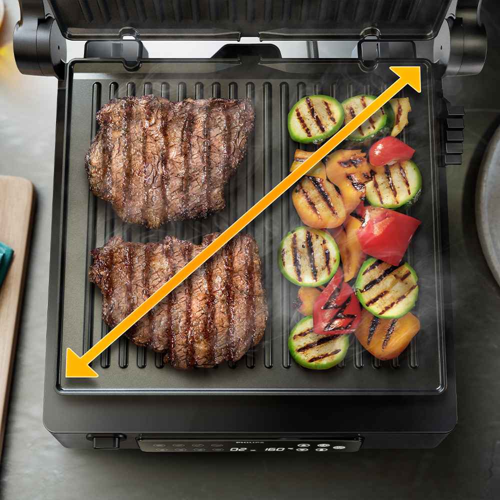 Philips grilu un tosteru līnija: attēlo steikus un dārzeņus, kas uz Philips grila tiek grilēti perfekti, izceļot vienmērīgu gatavošanu un daudzpusību, pateicoties leņķa indikatoram.