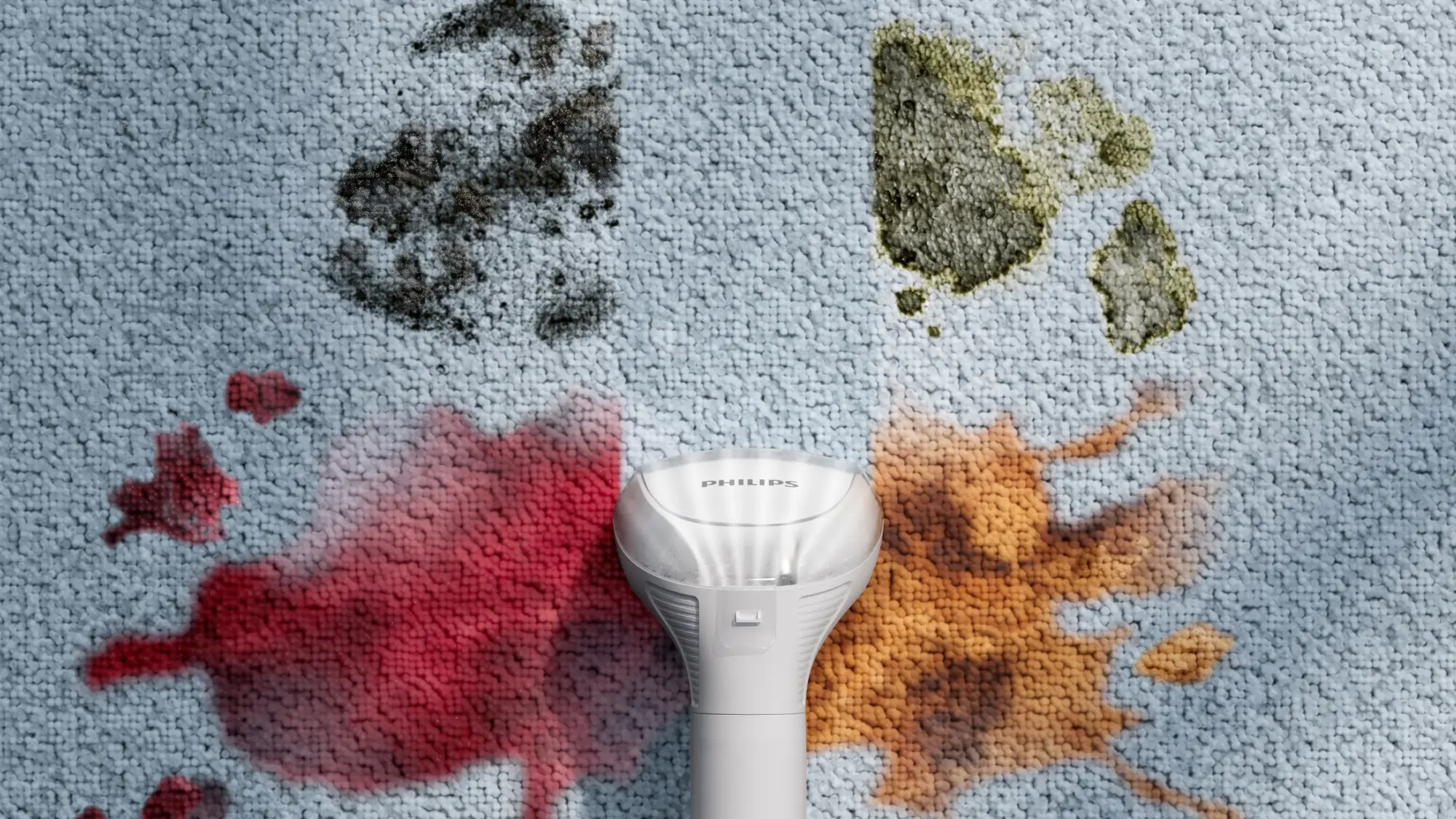 Philips traipu tīrītājs: Novērš traipus uz paklāja. Noņem vīna, kafijas, netīrumu un tauku traipus. Philips tīrīšanas līdzeklis centrēts, demonstrējot tā traipu tīrīšanas spēku un dizainu.